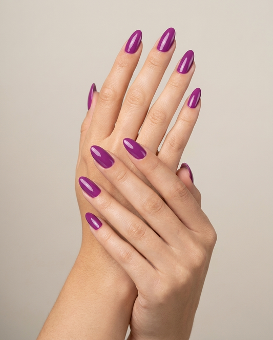 Hands with MineVital Royal Purple C06 manicure — vivid orchid-magenta purple water-based breathable nail polish on natural nails