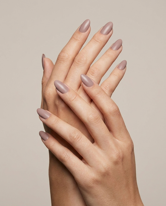 Hands with MineVital Nudeal C08 manicure — soft mauve-taupe nude water-based breathable nail polish on natural nails