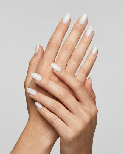 Hands with MineVital French B. D03 manicure — soft milky white French shade water-based breathable nail polish on natural nails