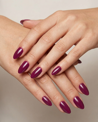 Hands with MineVital Special Nights D32 manicure — deep wine burgundy water-based breathable nail polish on natural nails